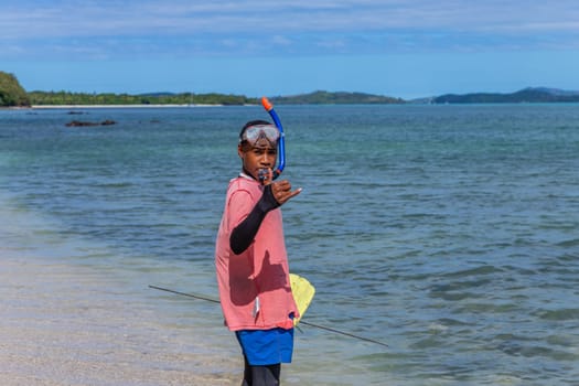 Nacula, Fiji: 26 May 2023: Local kid fishing at the beach, Nacula island in Fiji.