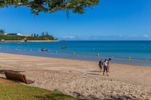 Noumea New Caledonia - 03 June 2023: People relaxing in the afternoon sun at the Beach in Noumea, New Caledonia.