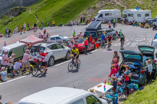 Col du Tourmalet, France - July 06 2023: Cycling fans waiting for the buch at the top of the Col du Tourmalet in Pyerenees mountains during the stage 6 of Le Tour de France 2023
