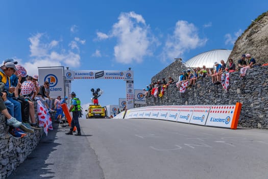 Col du Tourmalet, France - July 06 2023: Cycling fans waiting for the buch at the top of the Col du Tourmalet in Pyerenees mountains during the stage 6 of Le Tour de France 2023