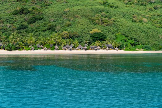 Fiji: 26 May 2023: Bungalows on beach at tourist resort, Yasawa Islands, Fiji. South Pacific Islands Pacific