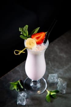 milkshake with strawberries, banana, mint and ice
