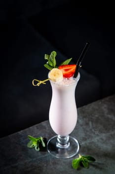 milkshake with strawberries, banana, mint and ice