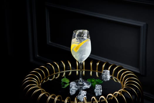 transparent carbonated cocktail with lemon and ice