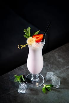milkshake with strawberries, banana, mint and ice