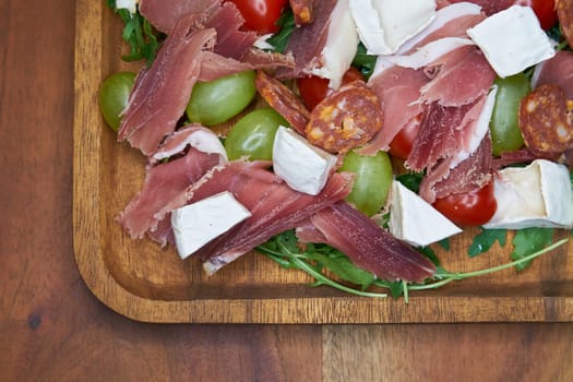 hearty snack with ham, cheese and salami in a restaurant in Italy