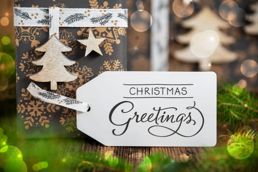 Text Christmas Greetings, On A White Label With Christmas Presents, Winter Gifts, Natural, Eco Friendly Background
