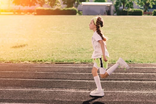 Girl jogging on a sunny summer evening, laying on treadmill, stadium, physical training, back to school, tired.