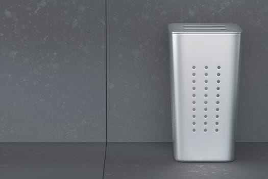 Silver laundry hamper with lid in empty laundry room