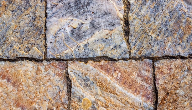 Brown stone with cracks on the surface