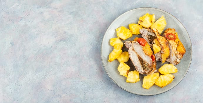 Appetizing meat roasted with fresh pineapple. Flat lay with copy space