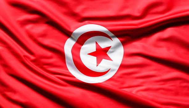 Tunisia flag with big folds waving close up under the studio light indoors. The official symbols and colors in fabric banner