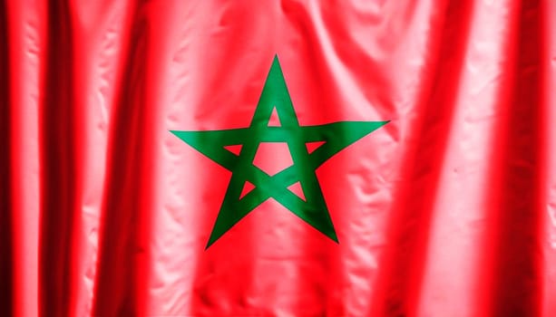 Morocco flag is depicted on a sports cloth fabric with many folds. Sport team banner