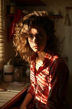 Young woman at a window in sunday early morning