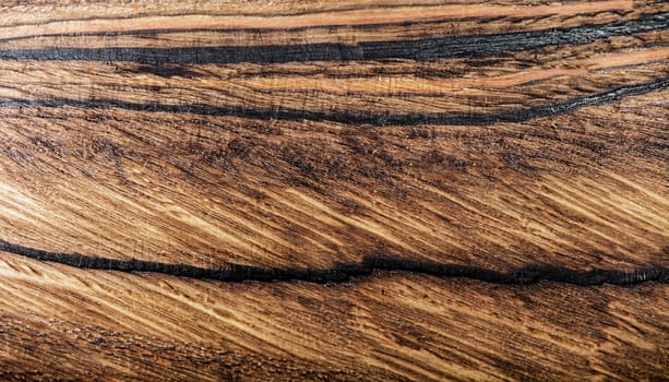 Texture of dark ebony wood. Dark natural background. Extremely high resolution photo.