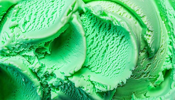Scoop of delicious chocolate chip mint ice cream with mint leaves and chocolate chips.