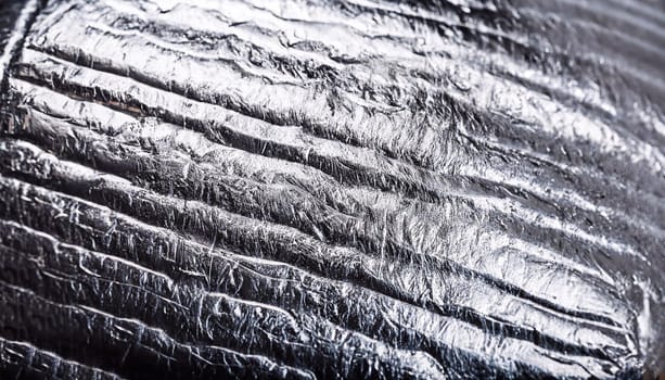 Silver texture of the material to be used as a background. High resolution photo.