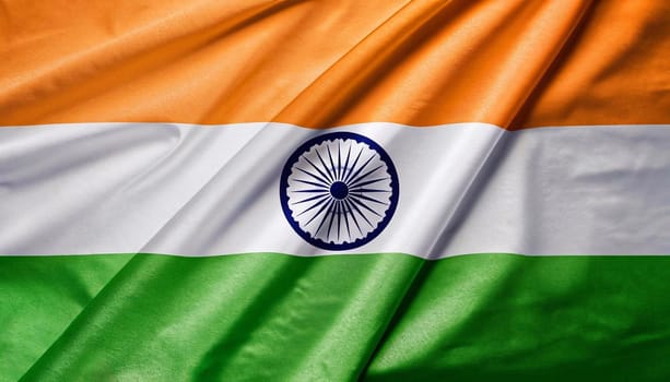 Close up realistic texture fabric textile silk satin flag of India waving fluttering background. National symbol of the country. 15th of August, Happy Day concept