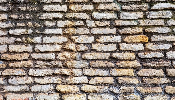 Texture of a stone wall. Old castle stone wall texture background. Stone wall as a background or texture. Part of a stone wall, for background or texture