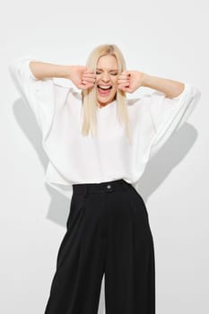 Woman screaming with joy or happiness on white background