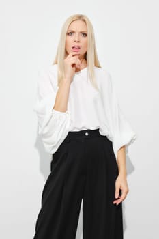 Portrait of a distrustful or doubting woman on white background