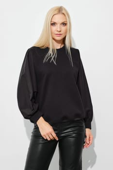 Portrait of stylish woman in total black outfit