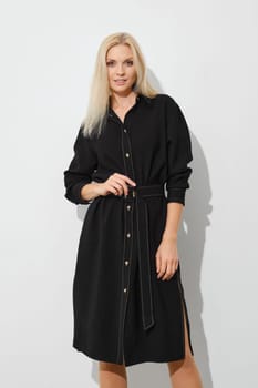 Stylish woman in black button down dress