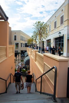AGIRA, SICILY, Italy - 30 SEP 2023. Sicilia Outlet Village shopping centre is a popular visitor magnet. People shopping at Sicilia Outlet Village.