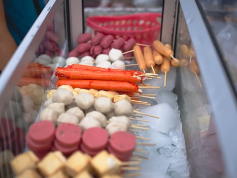 Meat and fish ball ,sausage wood stick at Street market , Thai Street food in Thailand.