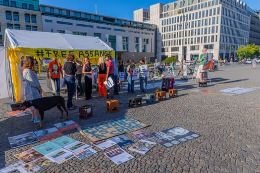 Berlin, Germany - 11 August 2023: Protesters with banners in support of a renowned activist and founder of WikiLeaks non profit organisation Julian Assange in the streets of Berlin