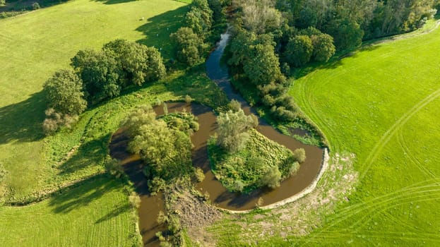 aerial view of a beautiful green landscape with a small river flowing through. It is in the eastern part of the Netherlands
