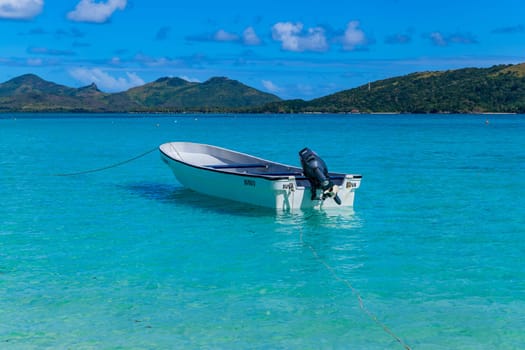 Nacula Fiji: June 25 2023: Boat in the stunning idyllic blue lagoon beach in the Yasawa island in Fiji in the south Pacific ocean