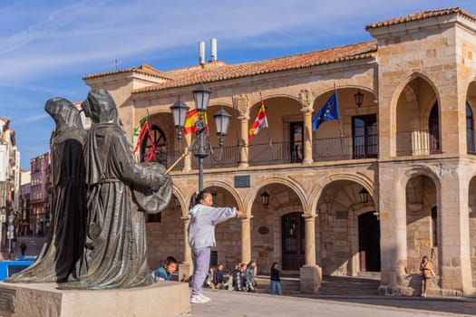 Zamora, Spain - March 22 2023: Kids playing in Old town hall in Zamora, a city in western Spain.
