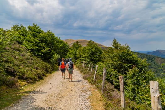 Navarre, Spain, 26 August, 2022: Pilgrims walk along the Camino De Santiago, the Way of St. James pilgrimage route, Navarra, Spain.