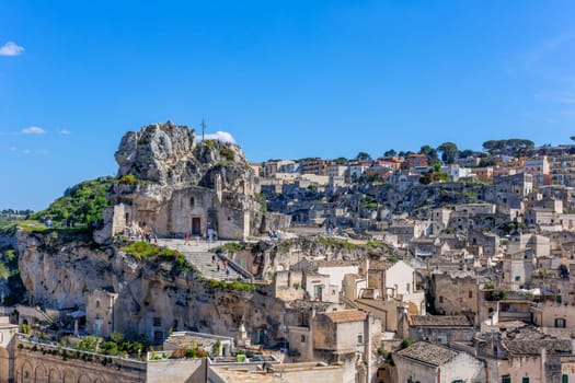 Matera, Italy - 6 May 2023: Ancient Unesco heritage old town of Matera (Sassi di Matera), Basilicata, southern Italy. Prehistoric cave dwellings