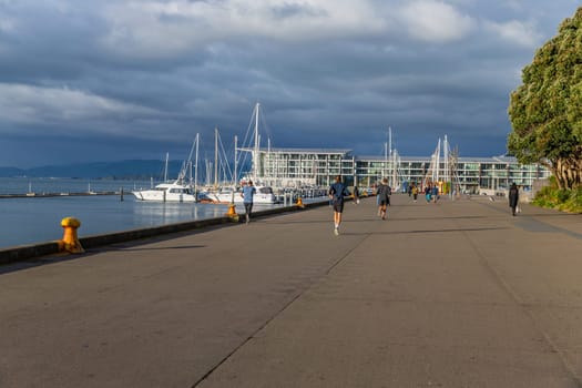 Wellington, New Zealand - 12 May 2023: People out enjoying sunny weather along the Wellington Waterfront