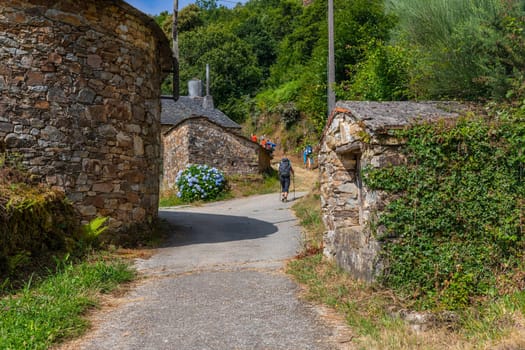 Galicia, Spain: 22 July 2023: Pilgrims on the Camino de Santiago (Pilgrim's Way to Santiago de Compostela) in Galicia, Spain.