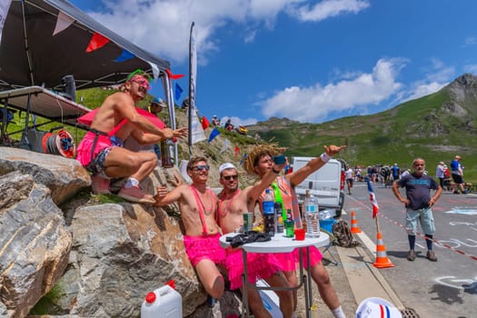Col du Tourmalet, France - July 06 2023: Cycling fans waiting for the buch at the top of the Col du Tourmalet in Pyerenees mountains during the stage 6 of Le Tour de France 2023