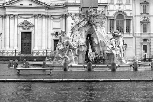 Black and white photo of empty  Navona Square with famous fountain in Rome. Italy. Horizontally.
