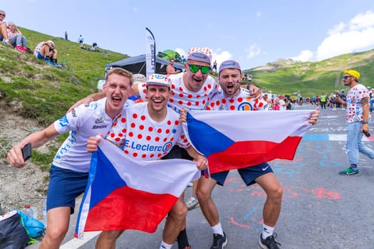 Col du Tourmalet, France - July 06 2023: Cycling fans waiting for the buch at the top of the Col du Tourmalet in Pyerenees mountains during the stage 6 of Le Tour de France 2023