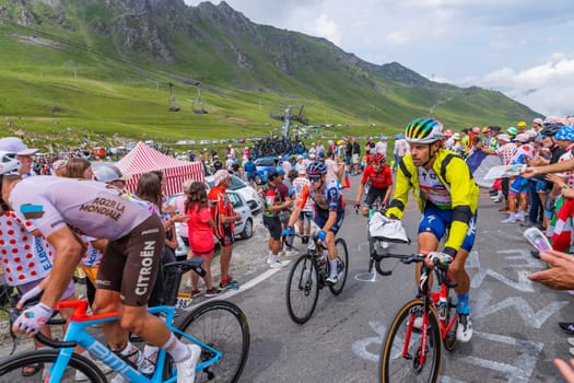 Col du Tourmalet, France - July 06 2023: Riders climbig the road to Col du Tourmalet in Pyerenees mountains during the stage 6 of Le Tour de France 2023.