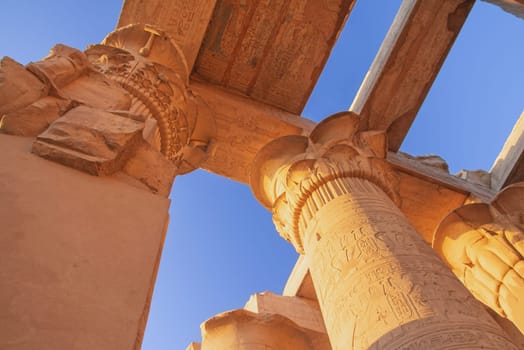 Columns at the Temples of Karnak.  Blue sky in the background. Luxor, Egypt.