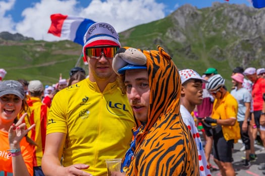 Col du Tourmalet, France - July 06 2023: Cycling fans waiting for the buch at the top of the Col du Tourmalet in Pyerenees mountains during the stage 6 of Le Tour de France 2023