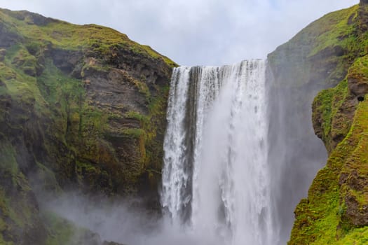 Beautiful Skogafoss waterfall. The most popular destination in Iceland. Water falling down a beautiful valley