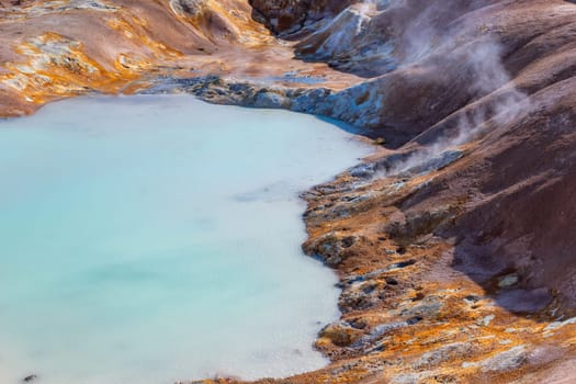 Landscape of Acid hot lake with turquoise water in the geothermal valley Leirhnjukur, Myvatn region, North part of Iceland, Europe
