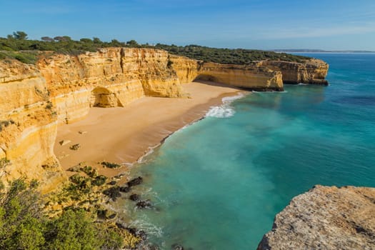 Waves at famous beach of Praia da Marinha. This beach is a part of famous tourist region of Algarve.