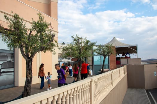 Agira, Sicily, Italy - 30 Sep 2023. Sicilia Outlet Village shopping centre is a popular visitor magnet for holidaymakers and locals alike. Entrance area.