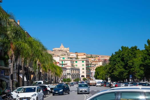 Milazzo, Sicily Italy - 03 October 2023. View from the street Via Francesco Crispi to Milazzo Castle (Castello di Milazzo) located on a hill overlooking the town.