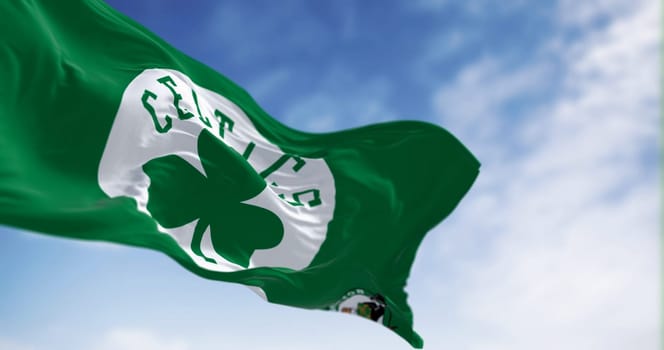 Boston, US, Sept 10 2023: Celtics Boston waving in the wind on a clear day. American professional basketball team, Eastern Conference Atlantic Division. Illustrative editorial 3d illustration render