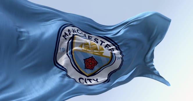 Manchester, UK, Oct. 10 2023: Close-up of Manchester City Football Club flag waving on a clear day. Illustrative editorial 3d illustration render. Rippled fabric